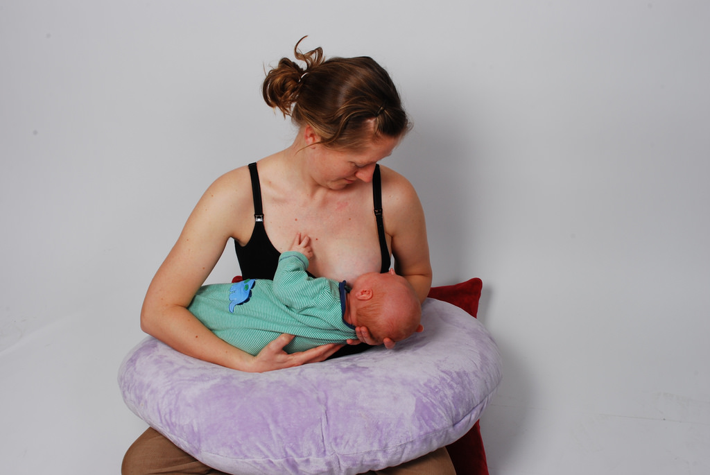 A mother breastfeeding her child