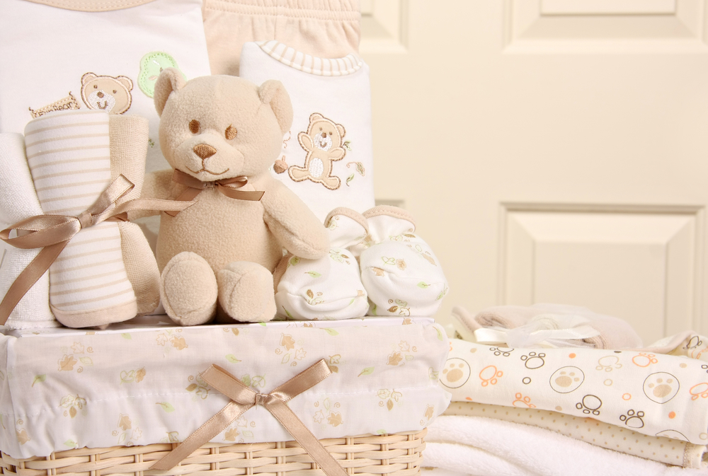 Teddy bear and baby clothes
